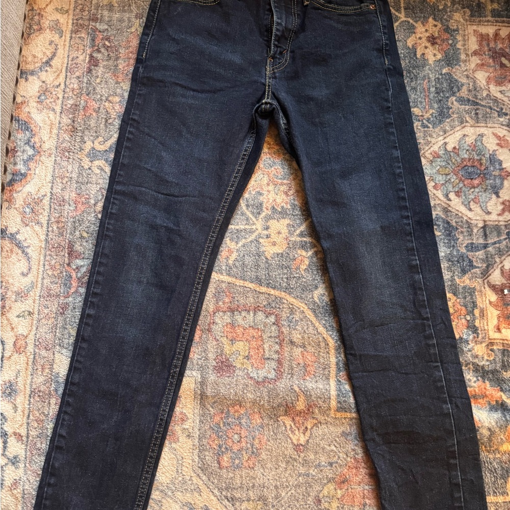 Levi's dark blue denim jeans with tan leather patch